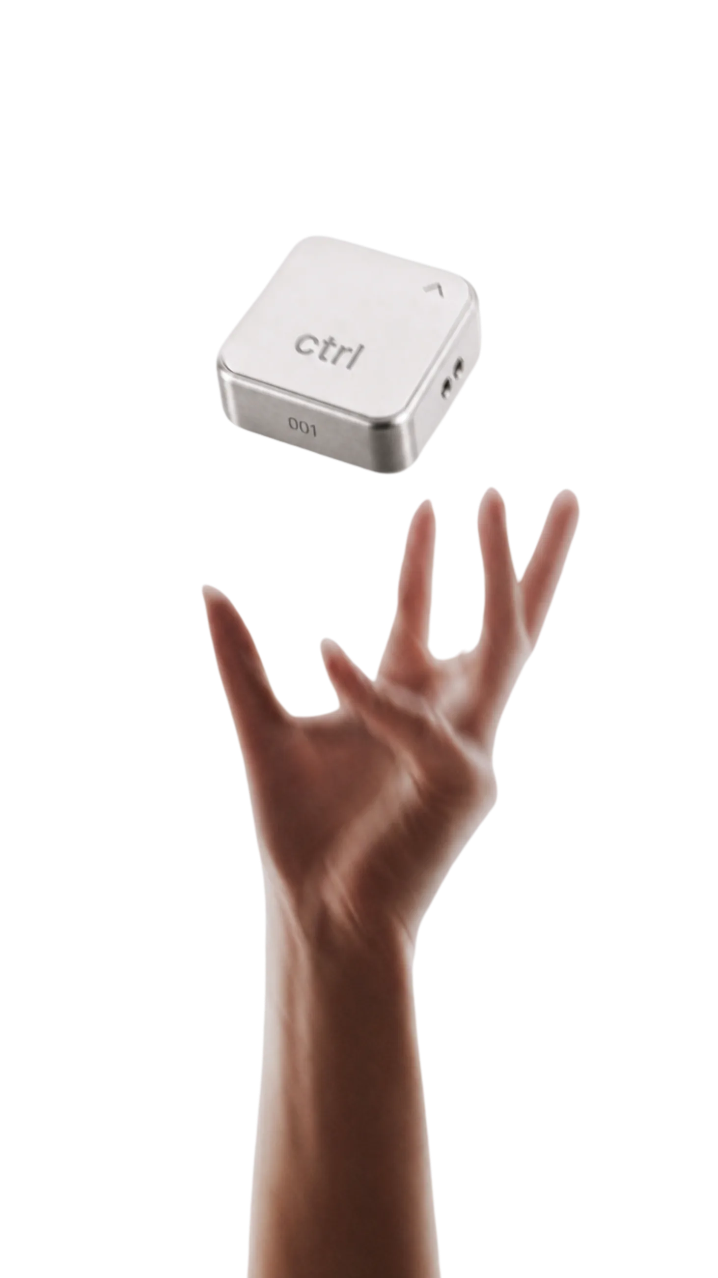 A hand holding the ctrl key