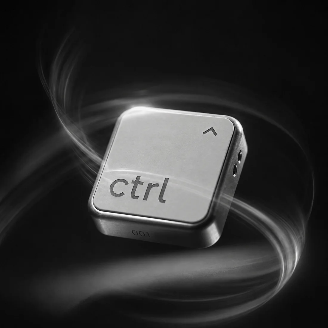 The ctrl key floating in the dark, light trails swirling around it