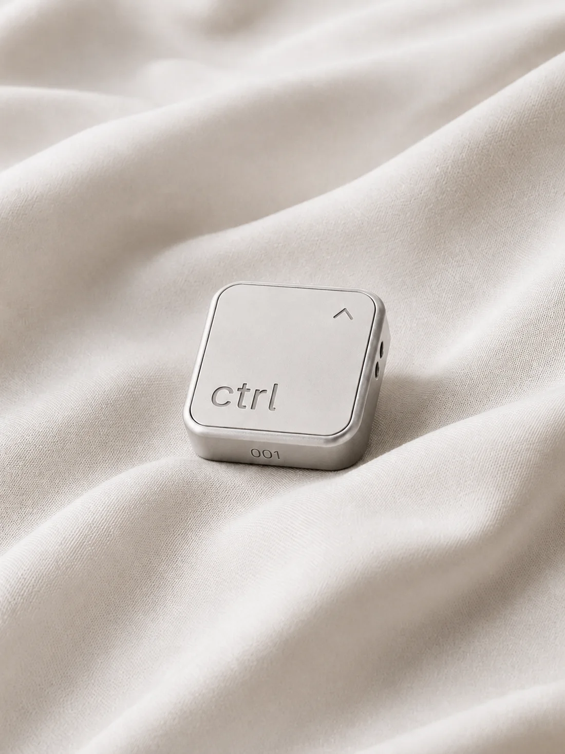 The ctrl key resting on soft cream silk